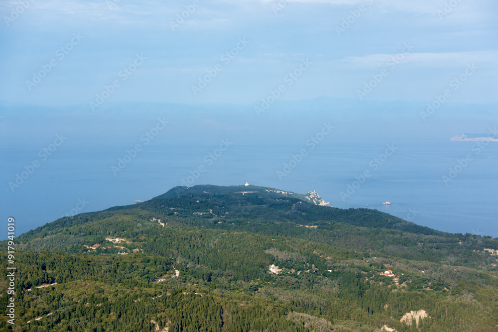 Amazing view down to the sea and the surrounding area from top of the mountain in Othonoi island, Greece Amazing view down to the sea and the surrounding area from top of the mountain in Othonoi island, Greece