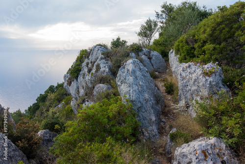 Beautiful path in the forest in Othonoi island, Greece, perfect for long walks photo