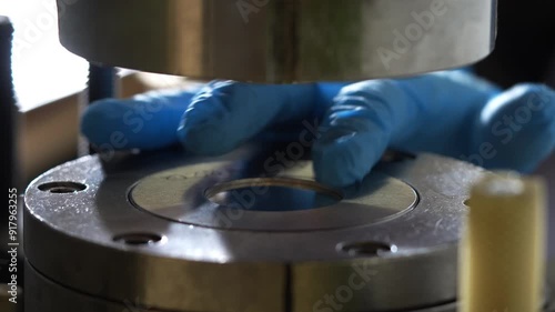 Close Up of a Metal Coin Being Pressed by a Machine