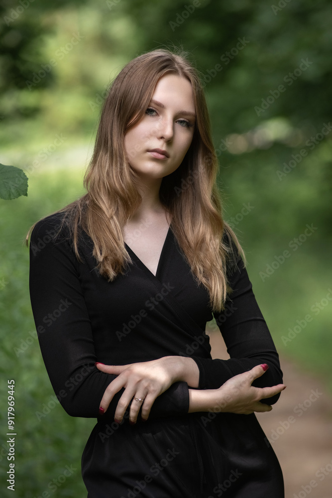 Portrait of a young beautiful long-haired girl in nature. Portrait of a young beautiful long-haired girl in nature.