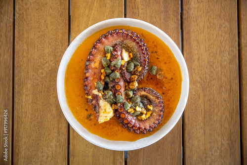 dish with octopus on the restaurant table