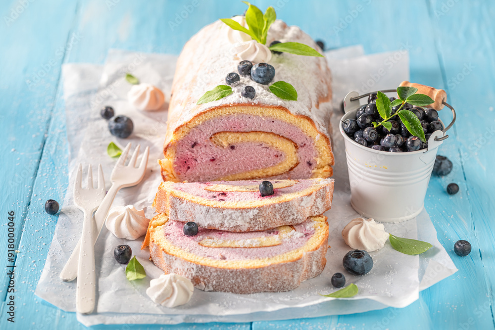 Φωτογραφία Homemade and delicious blueberry swiss roulade made of berry fruits