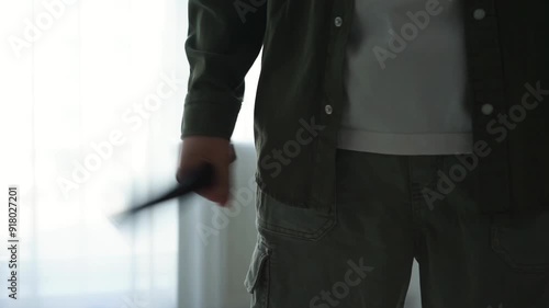 Domestic violence.
Close-up of a fist wrapped with a belt photo