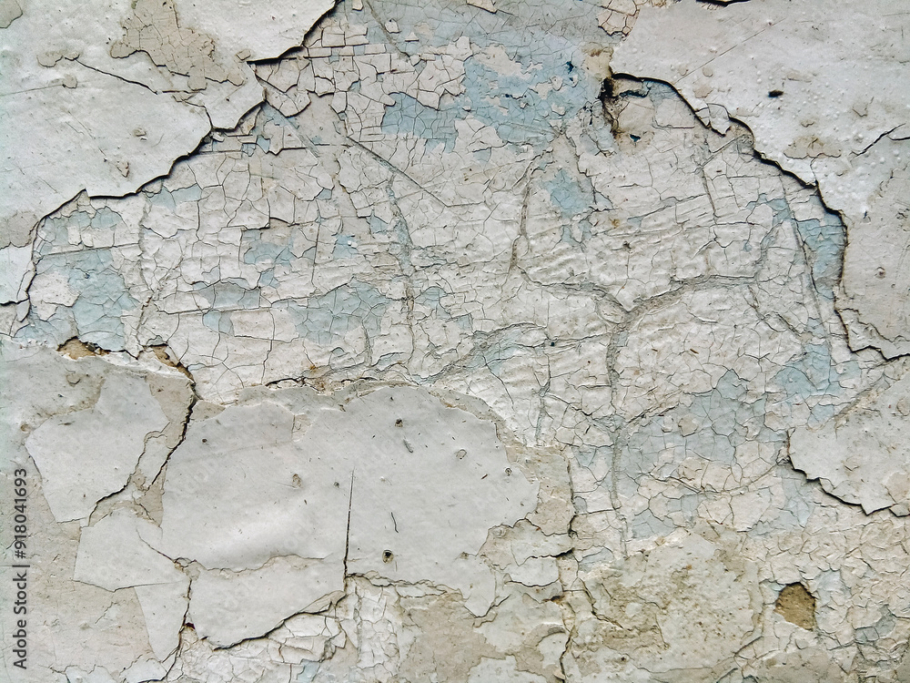 Fototapeta premium Light gray paint cracks texture on the wall surface. Vintage grunge background.