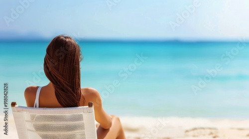 Relaxing Woman in Straw Hat by the Turquoise Ocean at a Tropical Beach