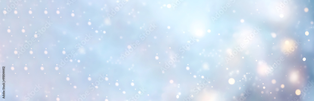 Winter blurred background with snow decorated with garland lights, holiday festive background