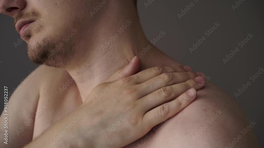 Close-up of a man's sore shoulder.
Guy massages his hand Close-up of a man's sore shoulder.
Guy massages his hand