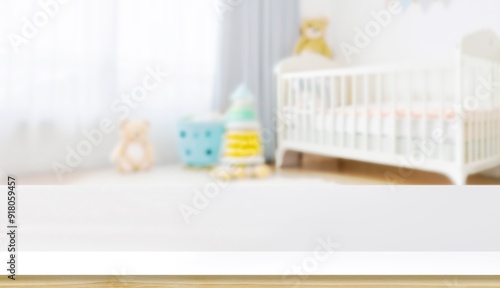 Empty wooden table with blurry baby room background, for design and decoration concepts