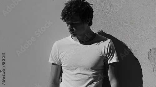 Thoughtful Man in a White T-shirt