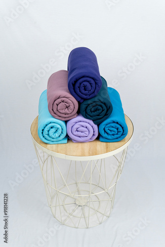 roll of polyester fabric in blue color variant with white background with high level 