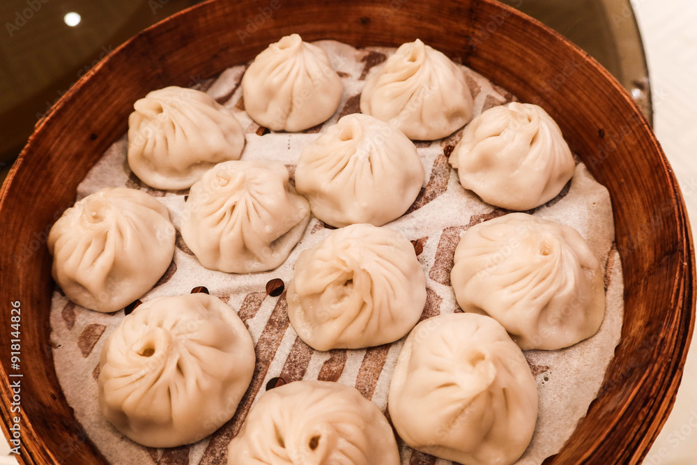 close up of Chinese or Taiwanese Shanghai style steamed soup dumpling buns or can be called close up of Chinese or Taiwanese Shanghai style steamed soup dumpling buns or can be called