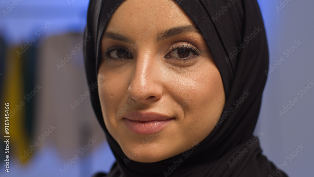 Carefree Islamic successful woman lady in hijab glad attractive cheerful model portrait happy Muslim female posing looking at camera indoors Arabian girl smile face close up blog in studio home beauty Carefree Islamic successful woman lady in hijab glad attractive cheerful model portrait happy Muslim female posing looking at camera indoors Arabian girl smile face close up blog in studio home beauty