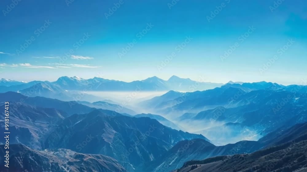 Majestic mountain vista with a clear blue sky, showcasing nature's grandeur. Majestic mountain vista with a clear blue sky, showcasing nature's grandeur.