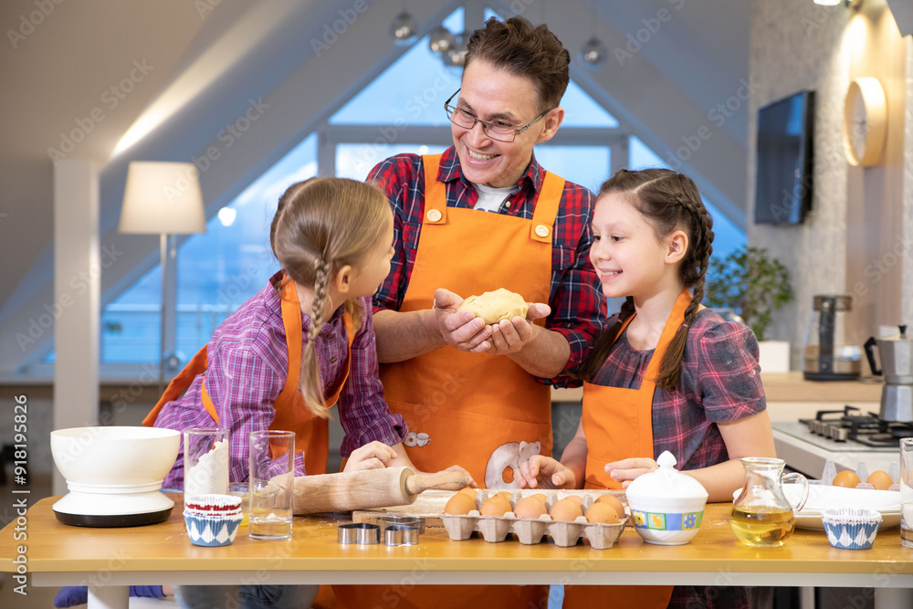 Family cooking in the kitchen at home