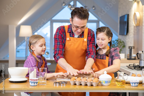 Family cooking in the kitchen at home