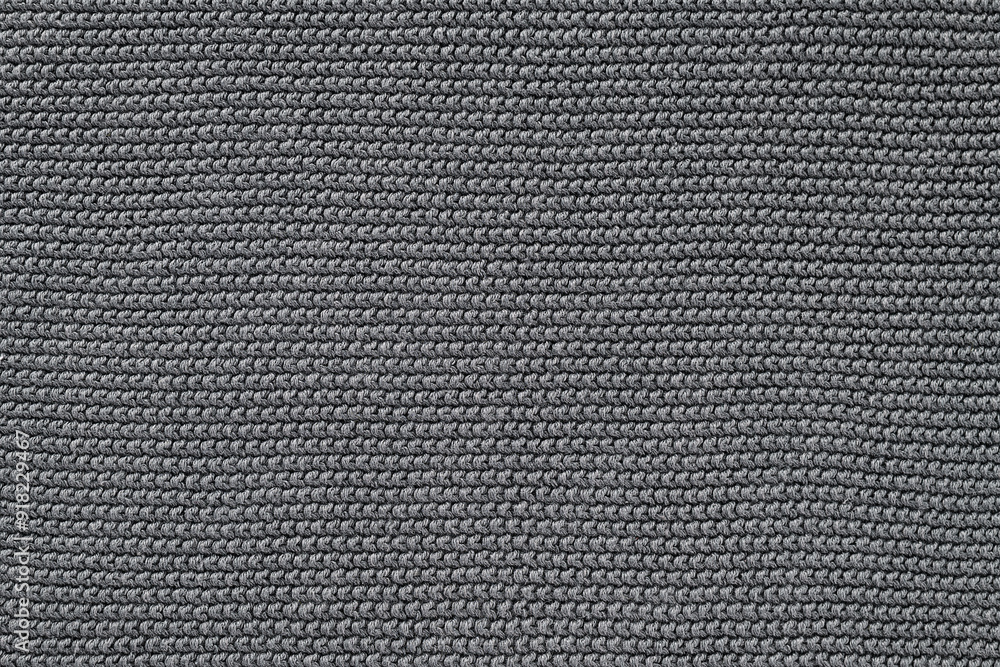 Close-up of gray knitted wool texture background Close-up of gray knitted wool texture background