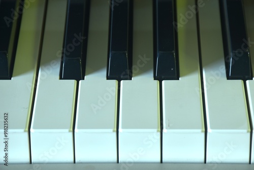 piano keyboard in house with shadow background and texture