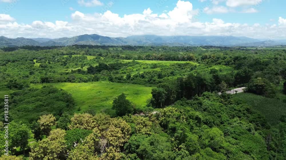 Long and narrow road cemented on the rugged terrain of a forested mountain in the Cordilleras. Drone aerial Long and narrow road cemented on the rugged terrain of a forested mountain in the Cordilleras. Drone aerial