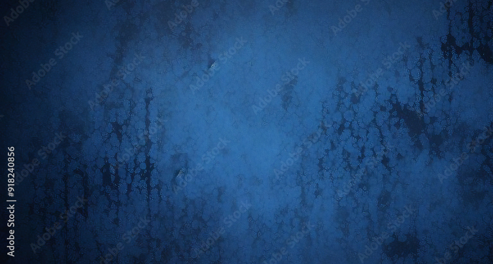 Fototapeta premium A backdrop of dark blue watercolor paint, providing a textured grunge effect that can serve as a dramatic background or banner.
