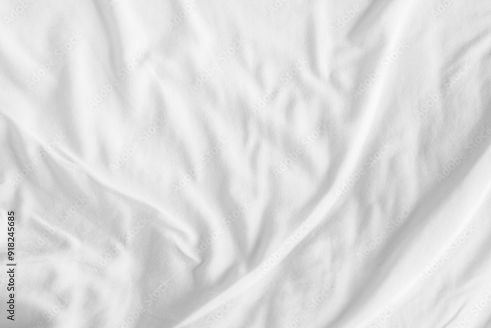Obraz premium Abstract White Bedding Sheets or White wrinkled fabric background texture and Texture with copy-space :Creased or wrinkled white fabric,Soft focus