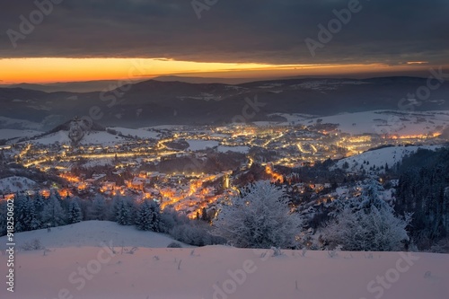 Blue winter morning in old romantic city. Wonderful, romantic winter mood in the city. Beautiful Christmas wallpaper. Winter night in Banska Stiavnica