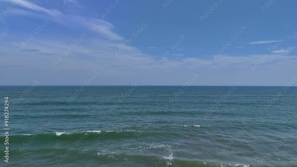 AERIAL Pacific ocean waves gentle hitting on a sand shore in Japan coastline AERIAL Pacific ocean waves gentle hitting on a sand shore in Japan coastline