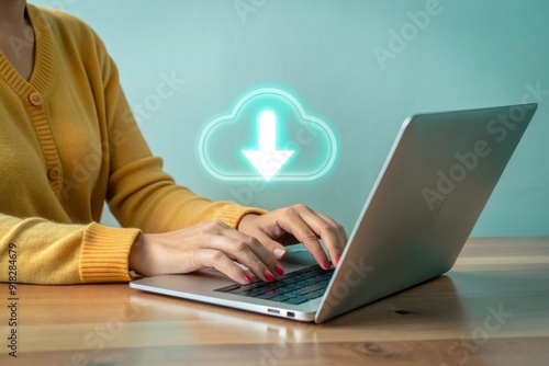 A woman is typing on a laptop with a cloud icon on the screen
