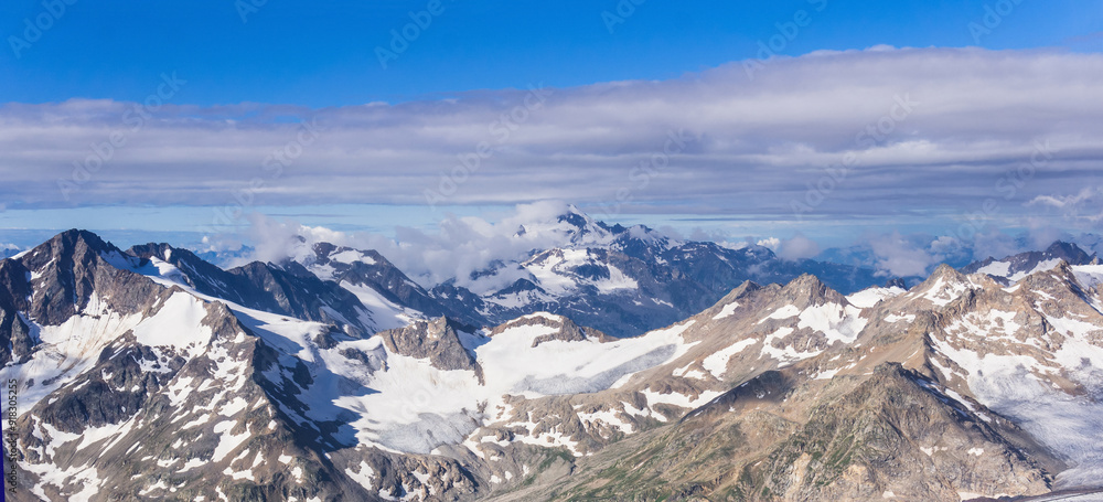 panoramic view of snowy high mountain peaks, Caucasus ridge. panoramic view of snowy high mountain peaks, Caucasus ridge.