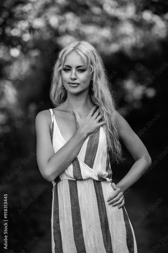 Portrait of a young beautiful blonde long-haired girl in nature. Black and white photo. Portrait of a young beautiful blonde long-haired girl in nature. Black and white photo.