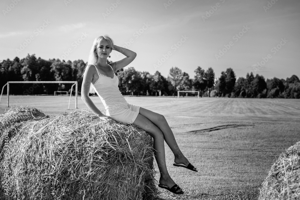 Portrait of a young beautiful blonde long-haired girl in nature. Black and white photo. Portrait of a young beautiful blonde long-haired girl in nature. Black and white photo.