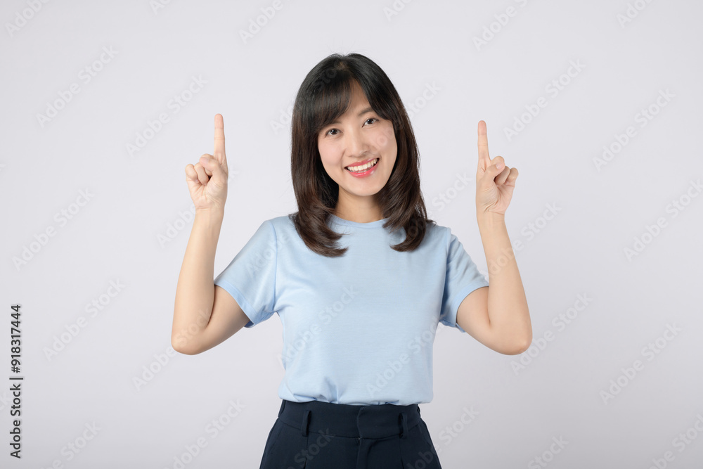 Pointing finger. young Asian woman pointing up to copy space and looking at camera with smile face and happy. Pretty girl act like satisfied product, use for advertising with isolated on white. Pointing finger. young Asian woman pointing up to copy space and looking at camera with smile face and happy. Pretty girl act like satisfied product, use for advertising with isolated on white.