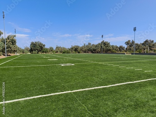 Small synthetic American football field with lighting in a public park, for training or entertainment