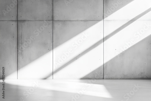 White room with sunbeams and concrete floors