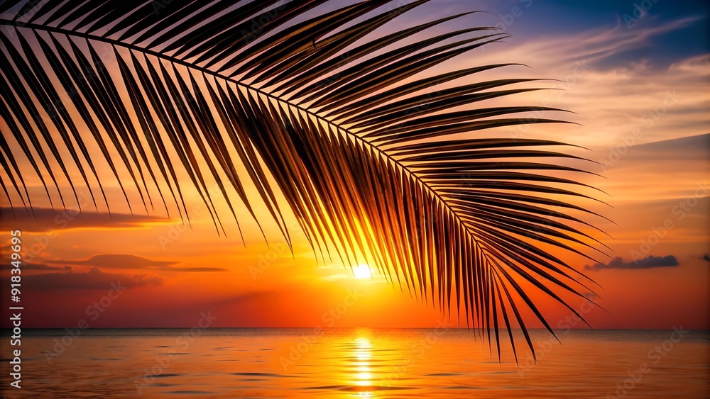 Obraz premium A Captivating Silhouette of a Palm Leaf Against a Fiery Sunset AI Generated