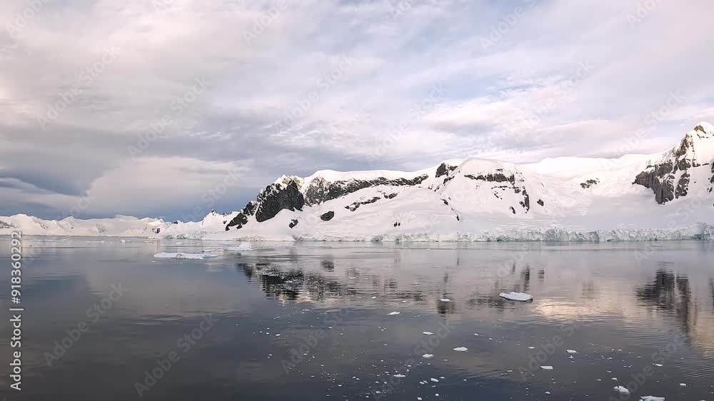 Exploring the breathtaking ice landscapes of Antarctica at sunset, showcasing stunning reflections and icy formations Exploring the breathtaking ice landscapes of Antarctica at sunset, showcasing stunning reflections and icy formations