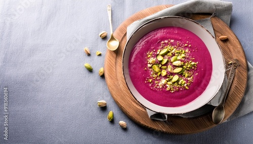 Wallpaper Mural Top view of bowl of sweet cold berry soup garnished with pistachios served on napkin board on table Torontodigital.ca