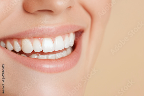 Perfect healthy teeth smile of a young woman. Teeth whitening. Dental clinic patient. Oral care dentistry, stomatology. Isolate beige backround. Dental care. Dentistry concept. Banner with copy space