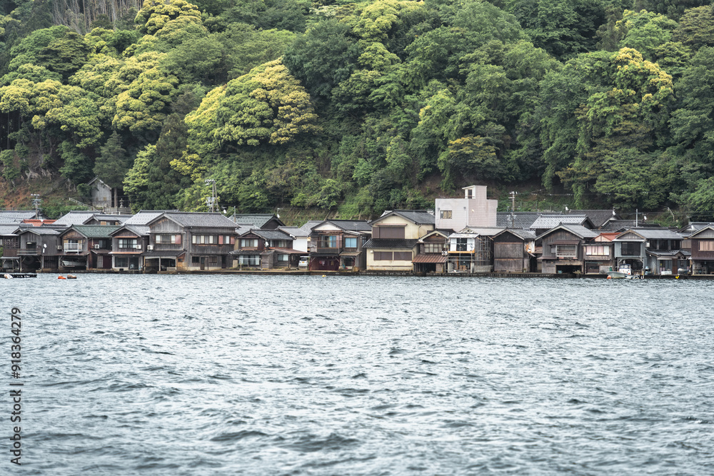 Beautiful scenic view with the wooden traditional waterfront boat houses called funaya around Ine Bay, in the village Ine, Japan Beautiful scenic view with the wooden traditional waterfront boat houses called funaya around Ine Bay, in the village Ine, Japan