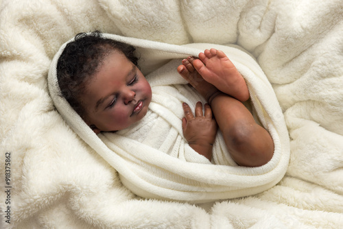 African reborn doll wrapped in white