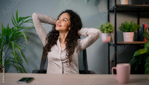 Close-up of a young businesswoman in the office doing stretching exercises.  photo