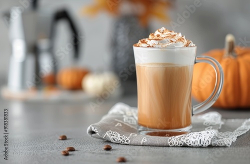 Creamy Pumpkin Spice Latte in a Cozy Setting With Seasonal Decorations