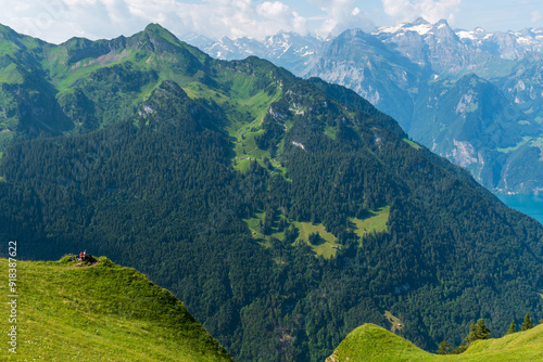 The Stoos hike in summer offers breathtaking views of the Swiss Alps, lush green meadows, and serene lakes. The trail is accessible yet challenging, with panoramic vistas that make every step rewardin