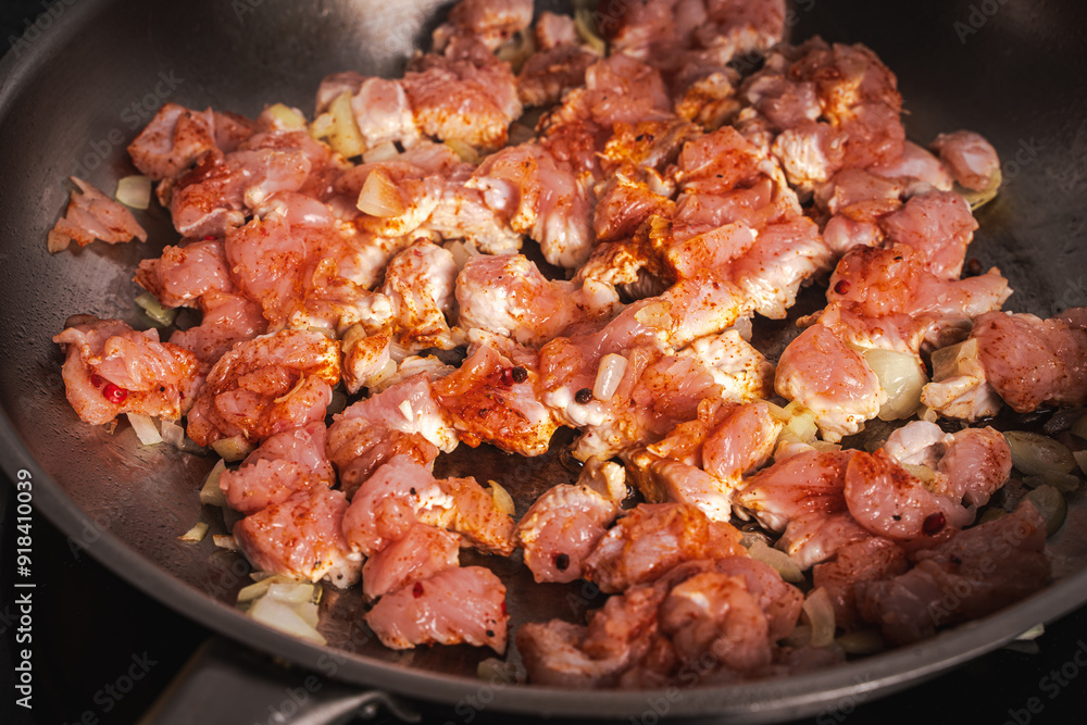 Turkey meat is fried in a pan. Background or banner, place to copy space, close-up. Turkey meat is fried in a pan. Background or banner, place to copy space, close-up.