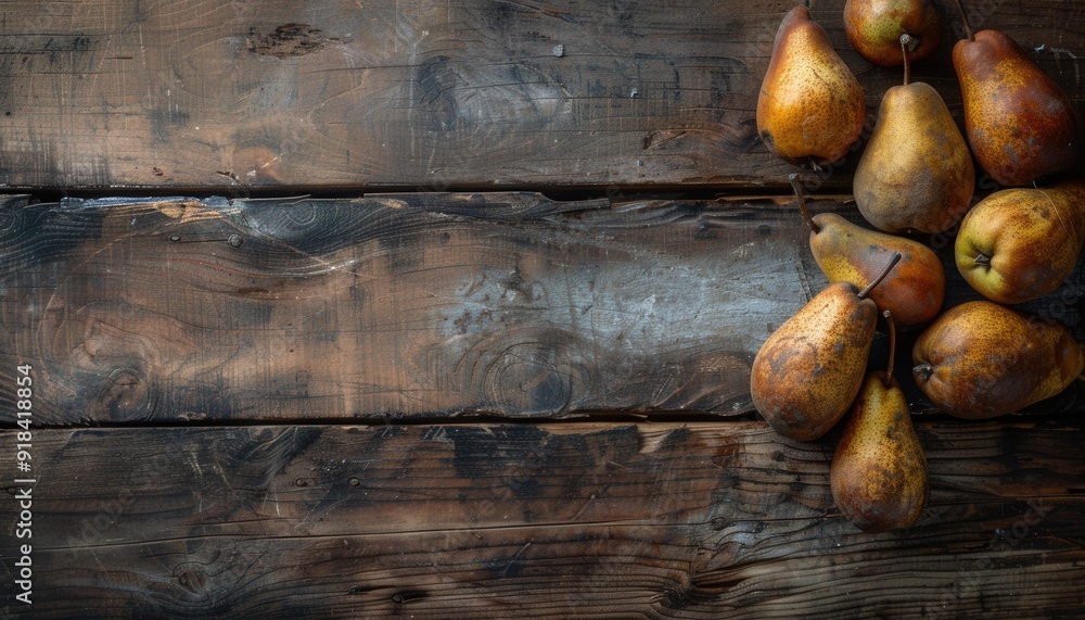 Freshly harvested pears arranged on a rustic wooden table with natural textures and earthy tones Freshly harvested pears arranged on a rustic wooden table with natural textures and earthy tones