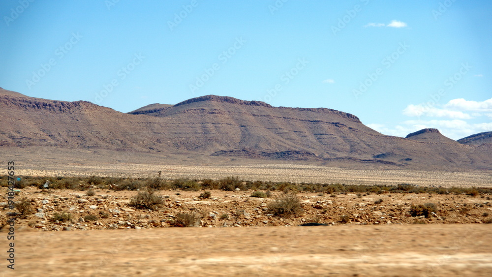 Mountains in the distance, on the road to Douz, Tunisia Mountains in the distance, on the road to Douz, Tunisia