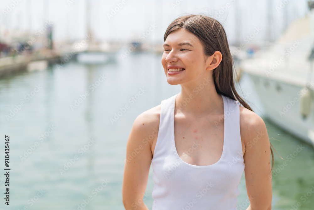 Young pretty woman at outdoors With happy expression Young pretty woman at outdoors With happy expression