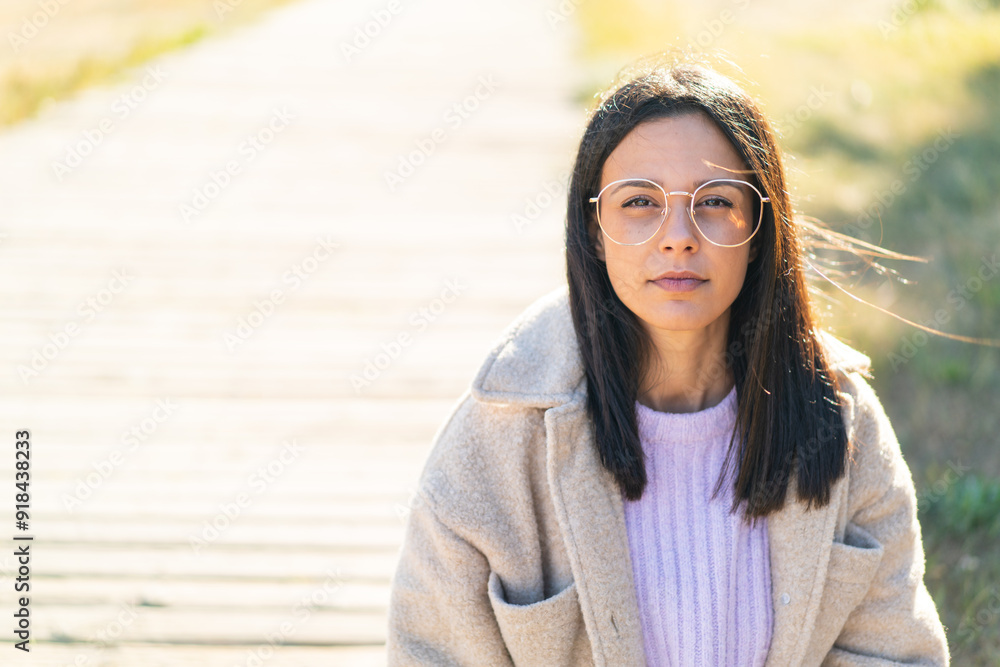 Young woman at outdoors With glasses Young woman at outdoors With glasses