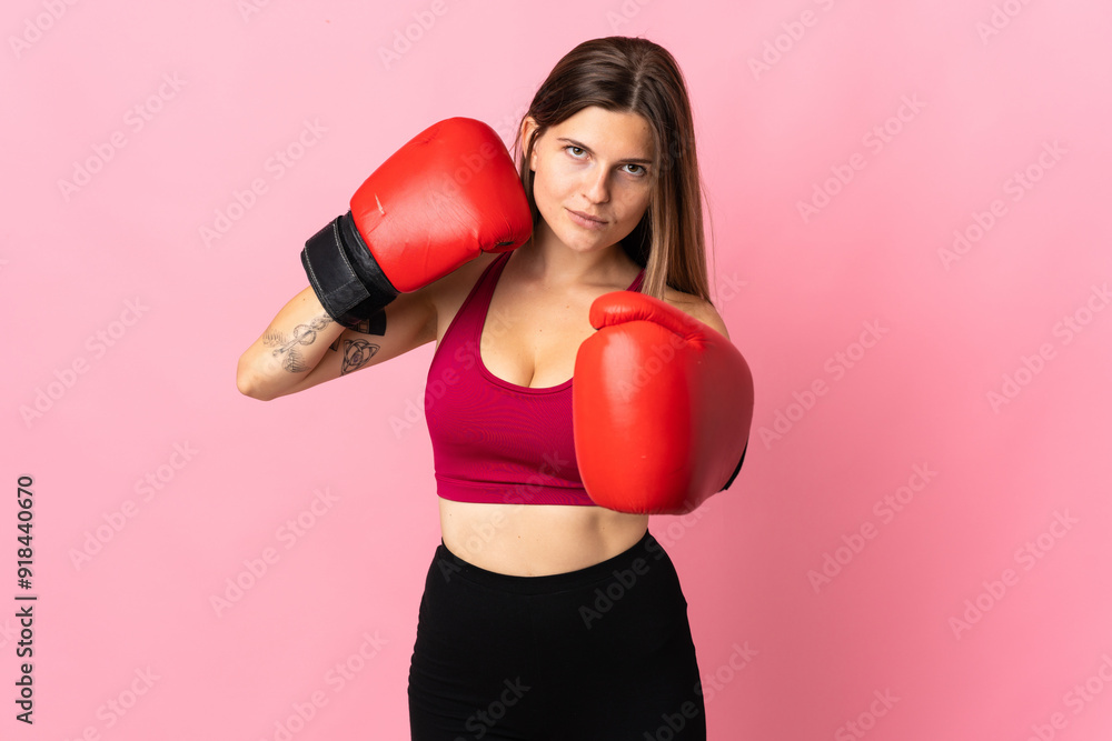 Young slovak woman isolated on pink background with boxing gloves Young slovak woman isolated on pink background with boxing gloves