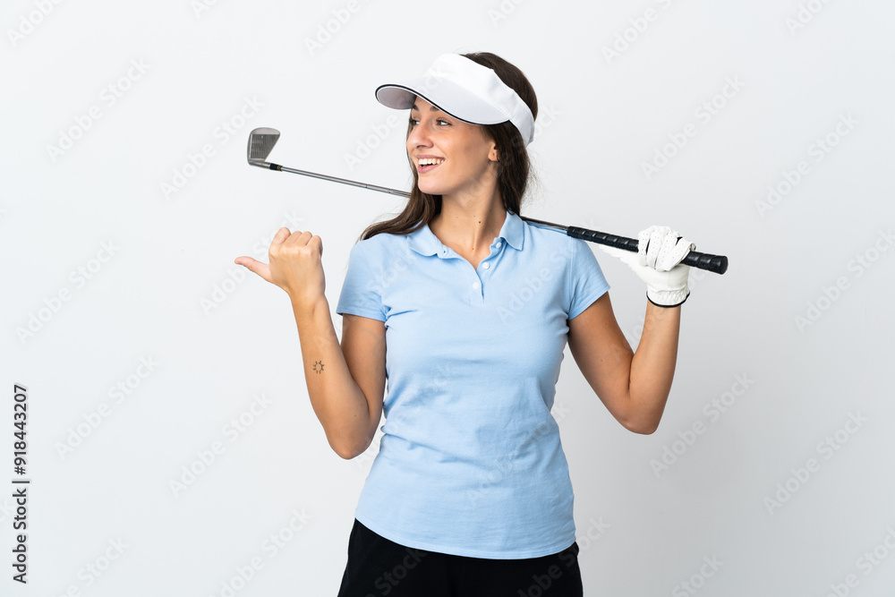 Young golfer woman over isolated white background pointing to the side to present a product Young golfer woman over isolated white background pointing to the side to present a product