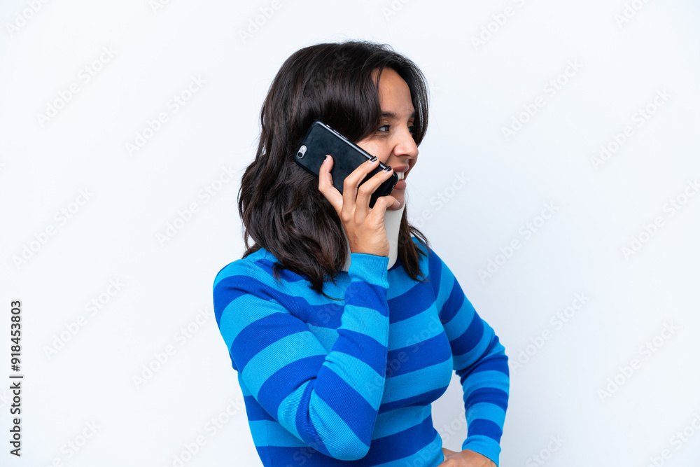 Young hispanic woman wearing neck brace isolated on white background keeping a conversation with the mobile phone with someone Young hispanic woman wearing neck brace isolated on white background keeping a conversation with the mobile phone with someone